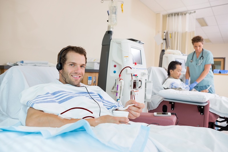 Patient on ward, Holding Glass Of Crushed Ice During Renal Dialysis